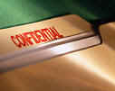 "Confidential" Stamp on a File Folder